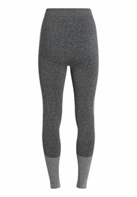 Leggings a vita alta in maglia grigia bicolore, con una finitura testurizzata e pannelli inferiori delle gambe in un grigio più chiaro a contrasto.