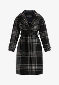 Kijelölve, schwarz karriert