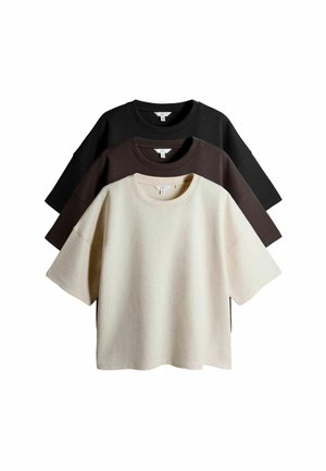 Drei übergroße T-Shirts in hellbeige, dunkelbraun und schwarz. Hergestellt aus weichem Stoff mit kurzen Ärmeln und lockerer Passform.