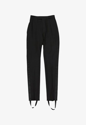Pantalon noir sur mesure avec jambe droite, bouton à la taille, bandes latérales et brides de pied attachées aux ourlets.