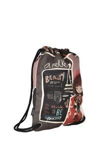 Bolsa de cordón con una ilustración de una chica y el texto: "La belleza comienza en el momento en que decides ser tú misma," cintas de cuerda negras sobre un fondo gris.