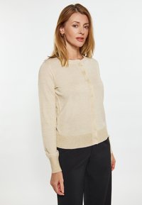 Lichtbeige cardigan van zachte stof, met een ronde halslijn, knopen aan de voorzijde en lange mouwen, met een geribde zoom en manchetten.