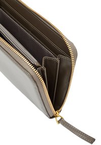Gray leather wallet with a zipper closure, featuring gold-tone hardware, multiple card slots, and a noticeable smooth texture.