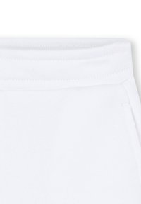 Pantaloni della tuta bianchi con una consistenza morbida e liscia, vita elastica e cuciture rinforzate. Design semplice senza motivi o dettagli.