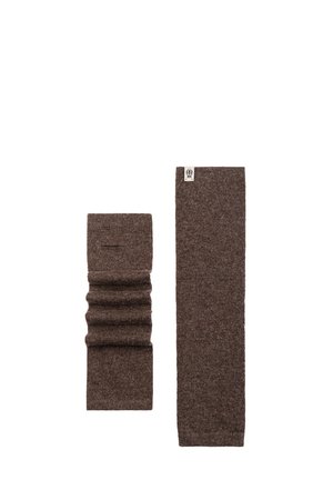 Two brown knitted wool arm warmers, one extended flat and one scrunched, both with a small white label on one end.