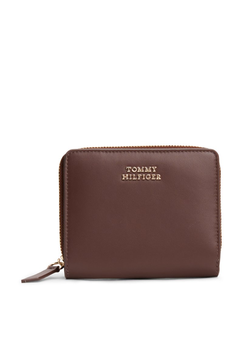 Brown leather zip wallet with gold-tone "TOMMY HILFIGER" logo, rectangular shape, smooth texture, and zippered closure for secure access.