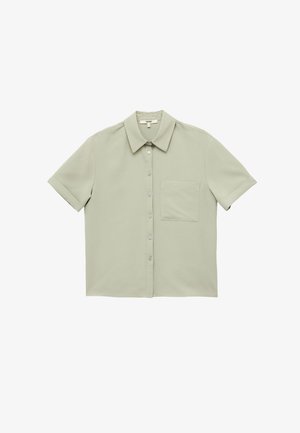Short-sleeve collared shirt in light green fabric, featuring a front button closure and a pocket on the left side. Smooth texture.