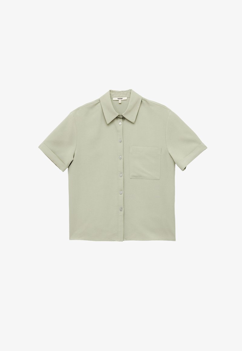 Short-sleeve collared shirt in light green fabric, featuring a front button closure and a pocket on the left side. Smooth texture.
