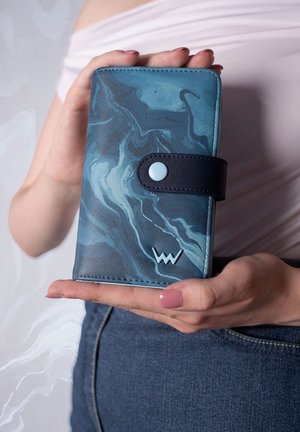 Blue marbled wallet made of synthetic material, featuring a dark leather strap and a light blue snap button, embossed logo on the front.