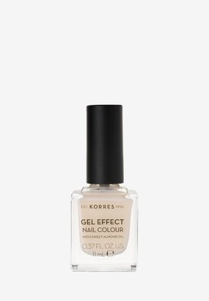 Lo smalto Korres Gel Effect in un flacone di vetro trasparente con un tappo nero. Contiene smalto beige chiaro con olio di mandorle dolci. 11 ml.