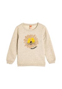 Sudadera de color beige claro hecha de material suave, con un gráfico de cara de león con acentos amarillos y el texto "WILDNESS" debajo.