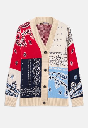 Knitted cardigan featuring a patchwork design in red, blue, beige, and navy with paisley patterns, a button front, and ribbed cuffs.