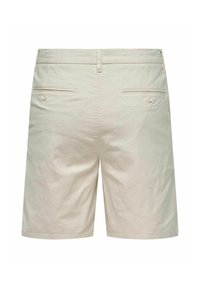 Beige cotton shorts with a straight cut, featuring two back pockets with button closures and a smooth texture.