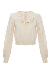 Blouse crème à manches longues avec col à volants, lien à l'avant, taille froncée et manches avec poignets, en tissu léger texturé.