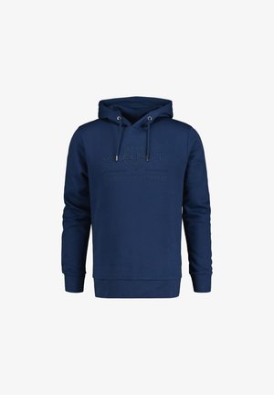 Marineblauwe hoodie van zacht materiaal, met een voorzak, een trekkoordcapuchon en een verhoogd logo op de borst. Klassieke pasvorm.