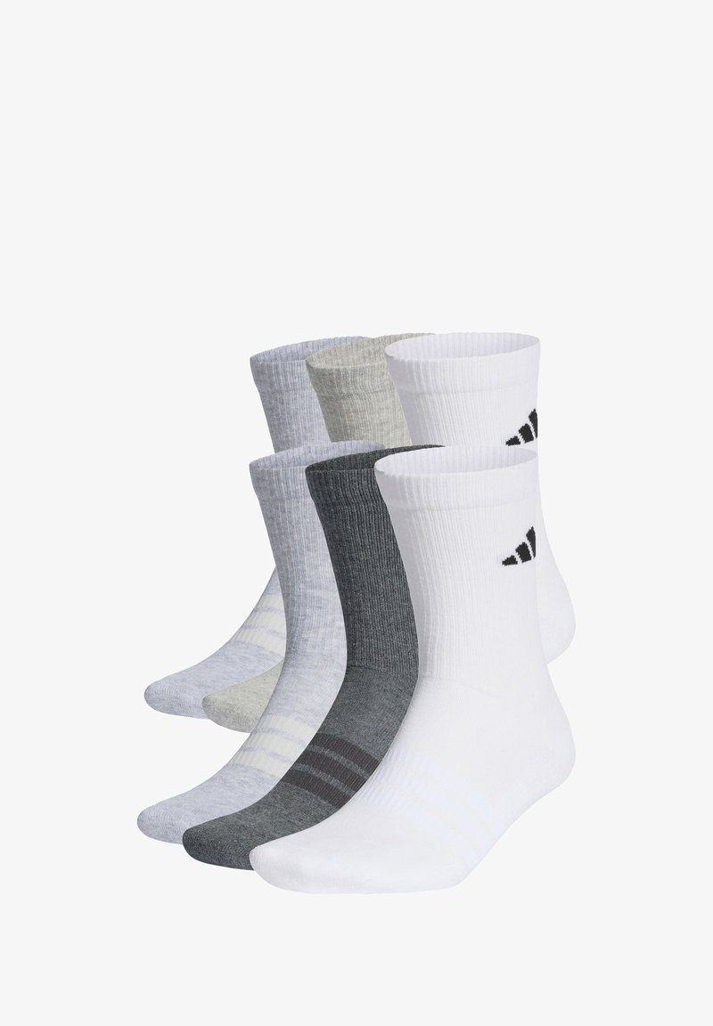 Set di quattro paia di calzini in tonalità grigio, bianco e nero. Presentano un design a coste, sfumature varie e il logo Adidas sui calzini bianchi.
