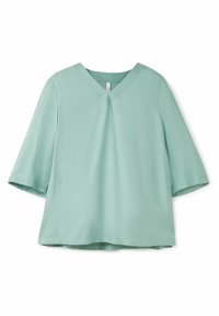 Blusa a maniche corte, con scollo a V in verde menta. Realizzata in tessuto morbido, con vestibilità comoda e una piccola tasca sul petto. Senza motivi o dettagli visibili.