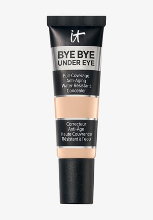 Tube de correcteur IT Bye Bye Under Eye à couvrance totale, anti-âge, résistant à l'eau avec capuchon noir et accents d'étiquette beige.