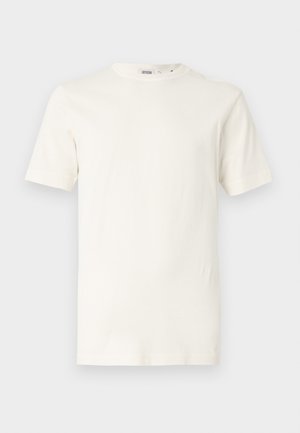 Lysebeige bomuld t-shirt med korte ærmer og rund halsudskæring. Har en glat tekstur og et enkelt design uden mønstre eller accenter.