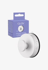 GLOV Hookie Pookie - imukoukku, pyöreä valkoinen muotoilu, jossa keskellä nuppi ja mustat kumikoristeet, pakattu violettiin laatikkoon. Kestää 5 kg.