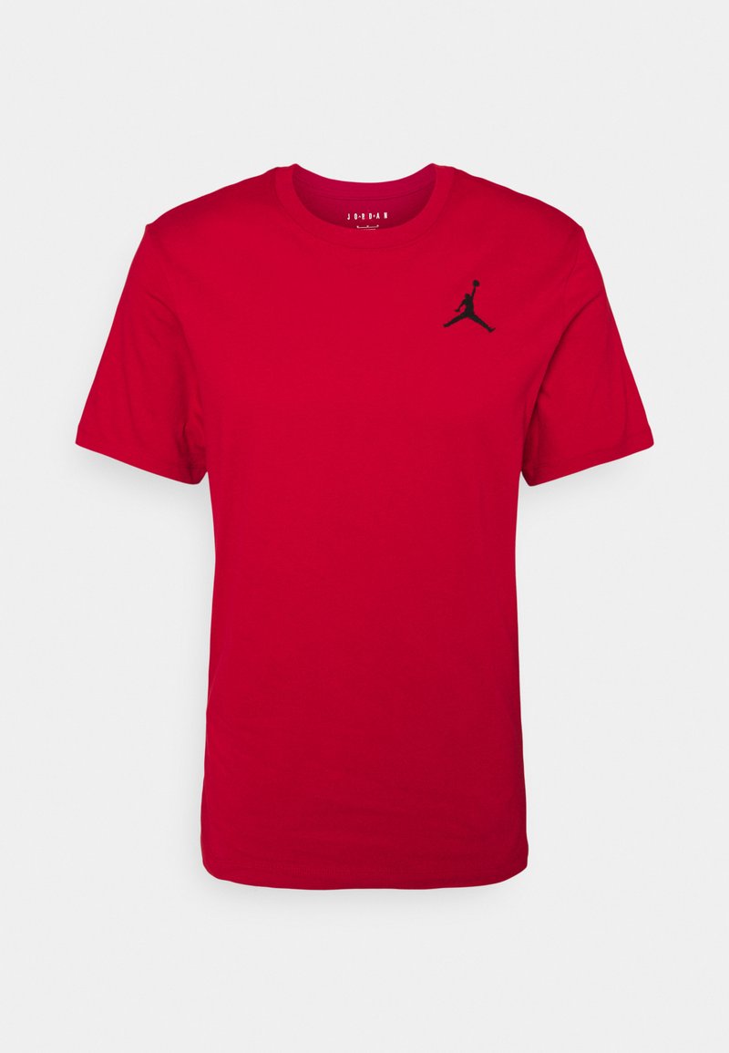 T-shirt in cotone rosso con maniche corte, con logo Jordan nero in alto a sinistra. Collo tondo, texture liscia, vestibilità regolare.