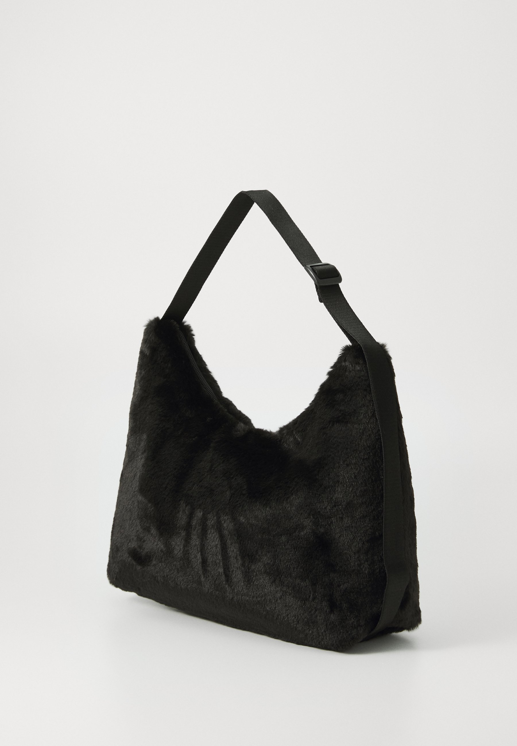 Puma SLOUCHY HOBO BAG - Cross body bag - black - Zalando.co.uk