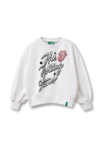 Sweatshirt blanc avec de longues manches bouffantes. Affiche un design graphique des "The Rolling Stones" en écriture noire et un logo en forme de langue rouge.