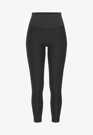 Čierne legíny s vysokým pásom, s textúrovaným vzorom v tvare včelích plástov po celom povrchu, vyrobené z elastického materiálu pre pohodlie.