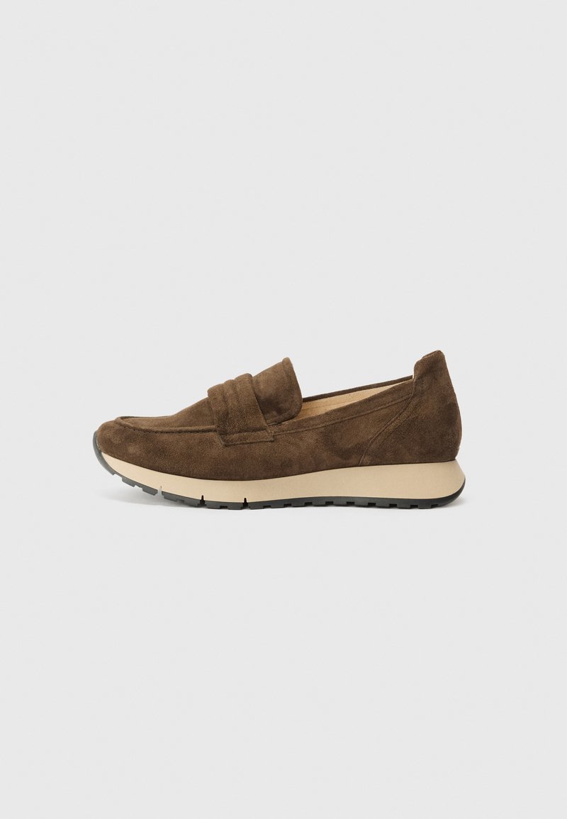 Brown suede slip-on shoes with a moccasin design, textured upper, and a contrasting beige rubber sole. Features subtle stitching accents.