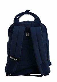 Navy blue backpack made of durable fabric features padded straps, a small top handle, and a recycling symbol on the back.