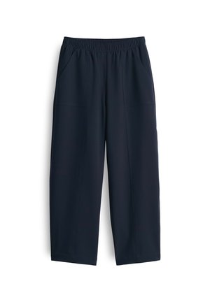 Navy blue trousers made of smooth fabric, featuring an elastic waistband, two side pockets, and a relaxed fit with straight legs.