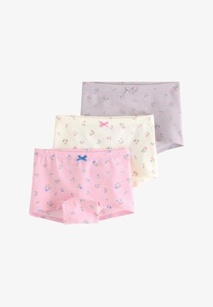 Tre pigers bomuldsundertøj i pastelrosa, creme og lavendel med små blomsterprint og små sløjfer på taljebåndet.