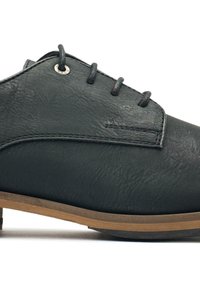 Black leather shoe with a textured finish, featuring four eyelets, brown sole, and subtle stitching details along the upper edge.
