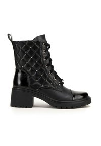 Black ankle boots with a quilted texture, featuring gold studs, black laces, and a chunky heel. Smooth patent accents on the toe and back.