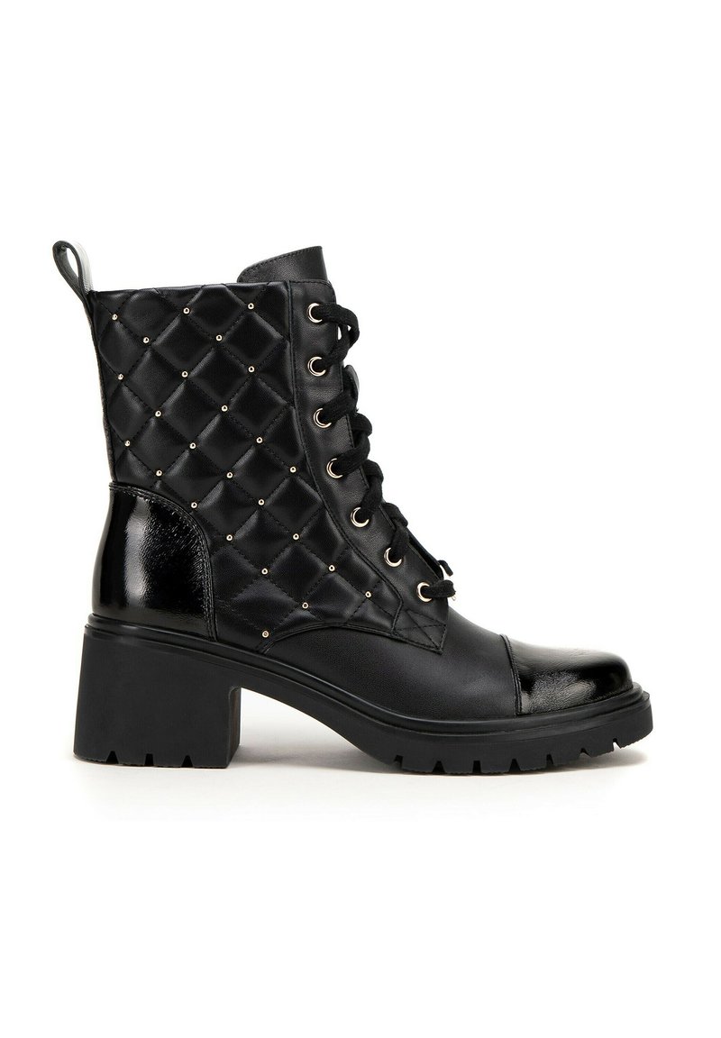 Black ankle boots with a quilted texture, featuring gold studs, black laces, and a chunky heel. Smooth patent accents on the toe and back.