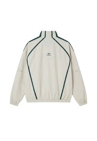 Beige jacket with dark green piping along sleeves and back, elastic cuffs, and a small central logo reading "PXP" on the upper back.