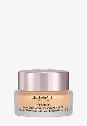 Elizabeth Arden Ceramide Lift and Firm Cream Makeup avec SPF 15 dans un pot givré avec couvercle métallique.