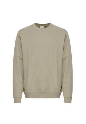 Beige crew neck sweatshirt made of soft fabric, featuring long sleeves and ribbed cuffs and hem. Simple, unadorned design.