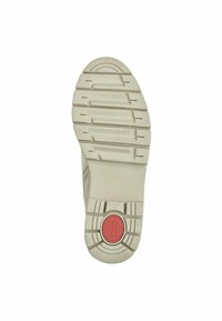 Semelle de chaussure en caoutchouc de couleur blanc cassé avec une texture antidérapante, dotée d'un accent circulaire rouge et d'une étiquette de taille bien visible (37) au bas.