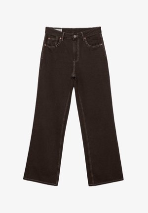 Tmavě hnědé džínové kalhoty širokých nohavic s předním knoflíkem, zipem a kontrastním bílým šitím. Obsahují přední kapsy a mincovní kapsu s měděnými nýty.