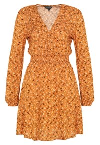 Oranssi kukkakuosiset mekko pitkillä hihoilla, V-pääntiellä ja joustavalla vyötäröllä. Kevyt kangas ja liukuva hame.