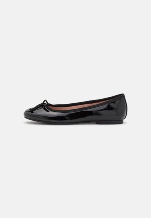 Black patent leather ballet flat with a rounded toe, thin bow accent on the front, and a smooth texture. Flat sole for comfort.
