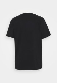 T-shirt en coton noir à manches courtes, col rond et coupe décontractée. Pas de logo ou de motifs visibles au dos. Texture lisse.