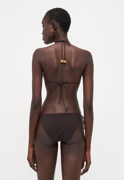 Brown bikini set featuring a triangle top with ties and matching low-rise bottoms, crafted from smooth fabric with adjustable straps.