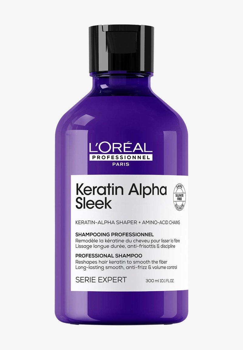 Lila L'Oréal Professionnel Keratin Alpha Sleek Shampoo-Flasche mit schwarzem Verschluss, die sulfatfreie, anti-frizz und glättende Eigenschaften betont.