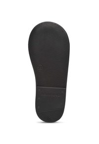 Suola di scarpa in gomma nera con scanalature orizzontali e una piccola area con il marchio "NATURINO" impresso. Include il dettaglio della taglia "21".