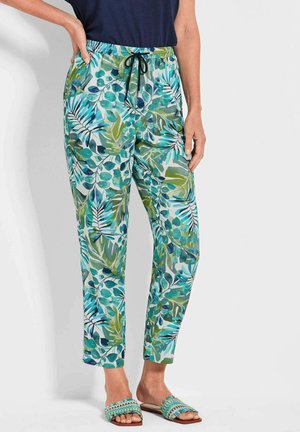 Lichte broek met een tropisch bladenpatroon in tinten van groen en blauw. Voorzien van een elastische tailleband met een zwarte trekkoord.