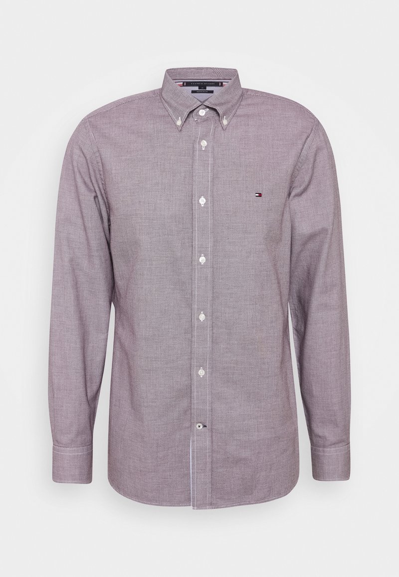 Long-sleeve, button-up shirt in a light purple checkered pattern, made from textured fabric with white buttons and a small logo on the chest.