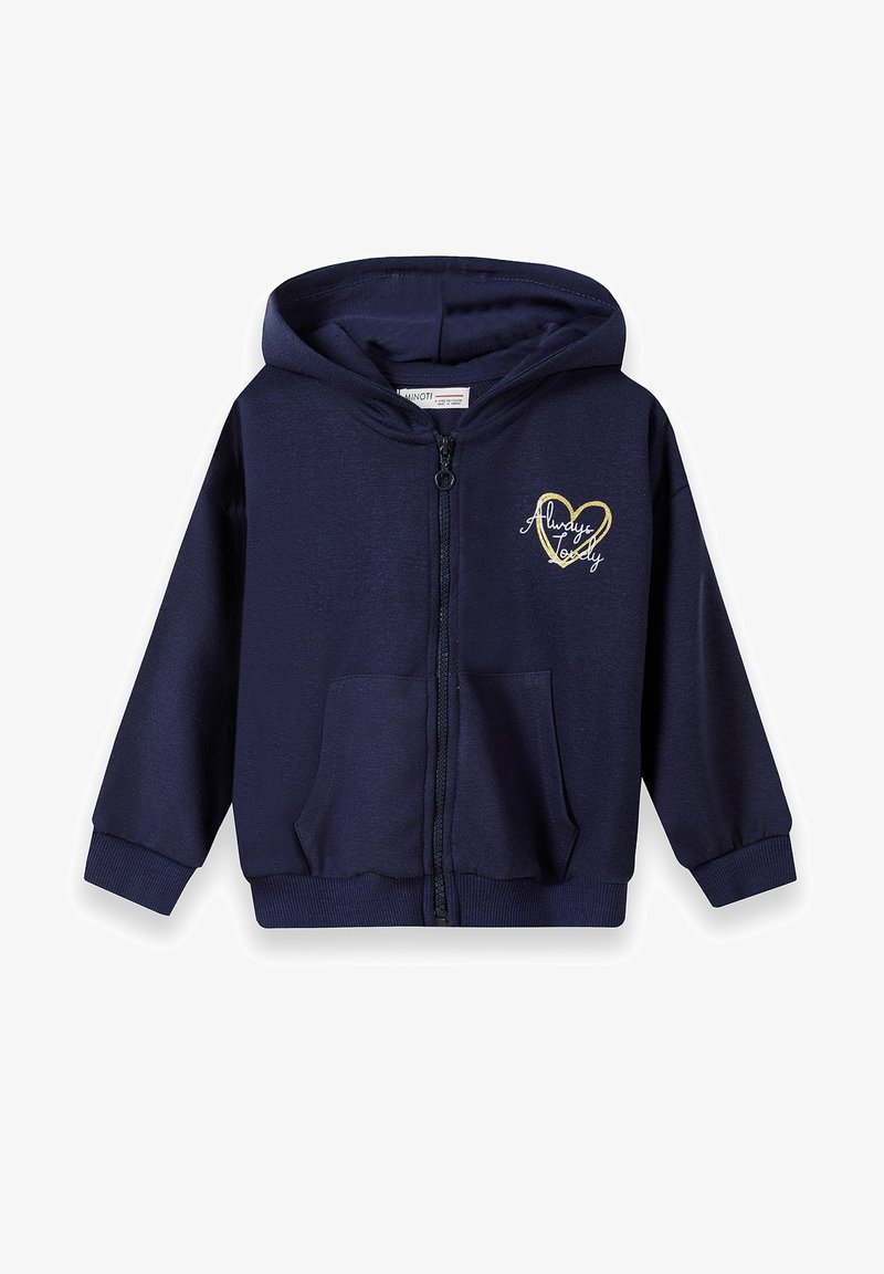 Tmavomodrá mikina na zips vyrobená z mäkkého materiálu, s prednou vreckom a zlatým srdcovým grafickým motívom s nápisom "Vždy nádherná" na hrudi.