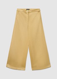 Pantalon à jambes larges dans une teinte jaune miel unie. Confectionné en tissu lisse, doté d'une fermeture boutonnée à l'avant et de poches latérales. Détail à ourlet plat.